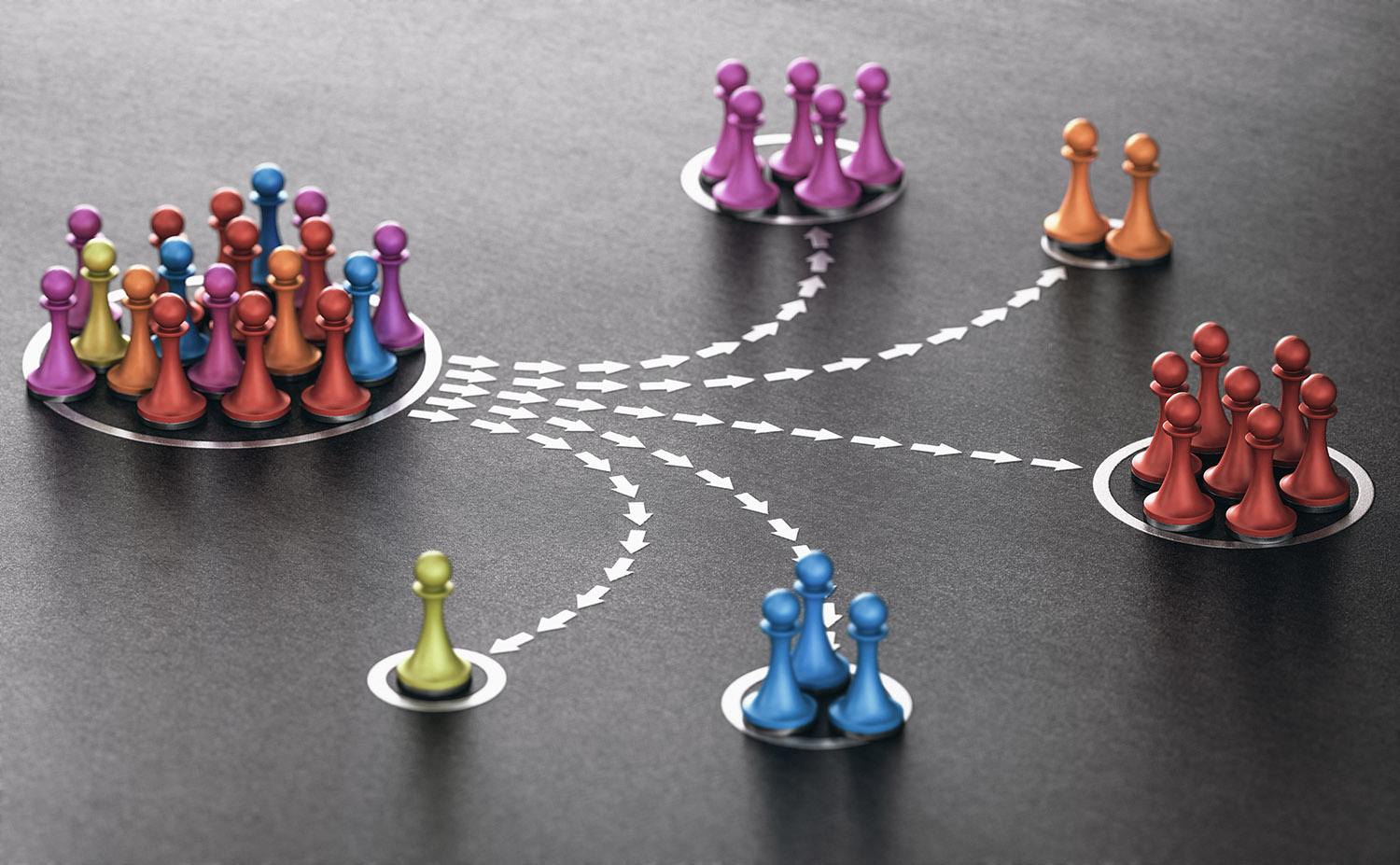 A group of colorful chess pieces sitting on top of a table